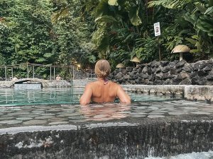 Woman sat in hot springs