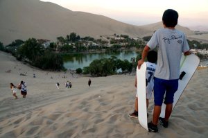 If your kids are old enough, they can have a go at sand boarding!
