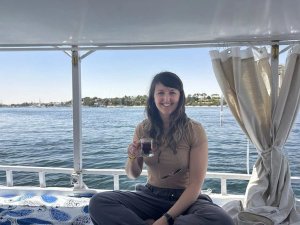 woman on boat drinking tea
