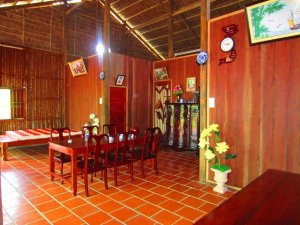 Red dining area, tiled floors and dining table