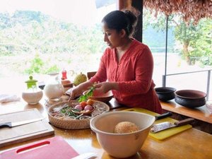 Woman cooking in outdoor kitchen