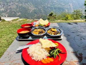 Nepalese food served on plastic red plates