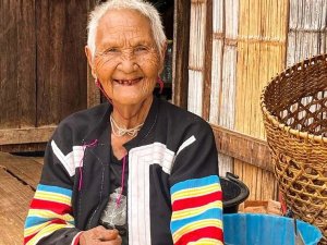 Woman smiling in colourful jacket