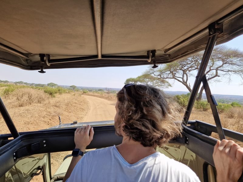 Miles in jeep on safari looking out