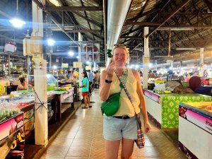 Woman holding food at market