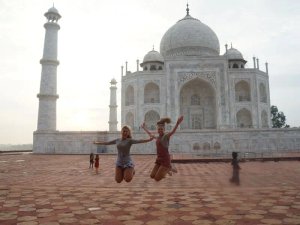 Kids jumping in front of Taj Mahal