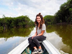 Brazil amazon manaus woman sat on boat