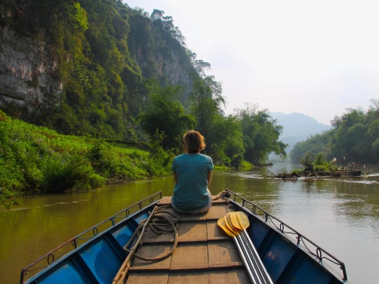 Person sitting on the end of boat