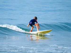Mui Ne boy surfing