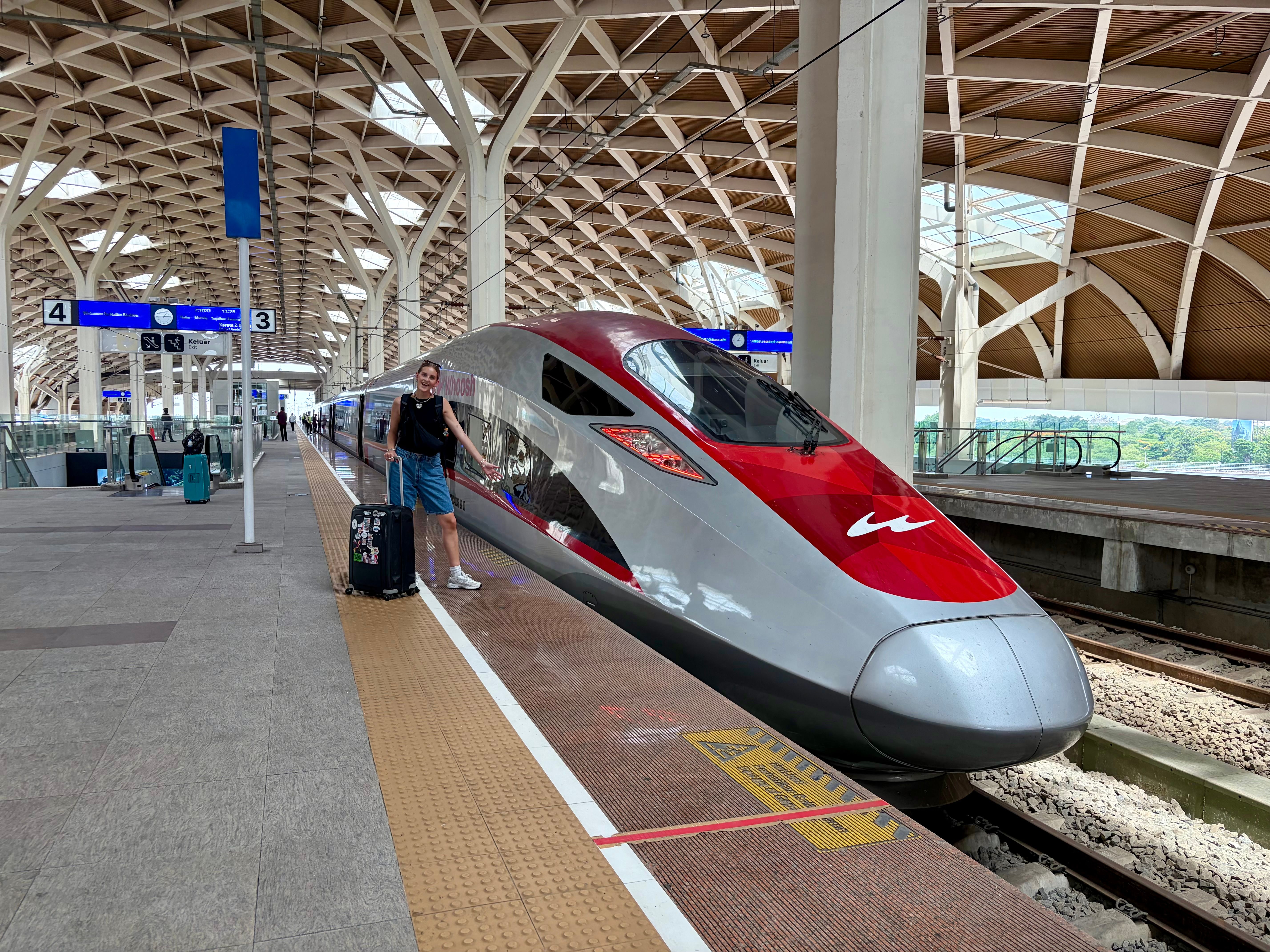 Child smiling as bullet train goes by