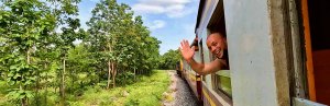 Traveller waving from train