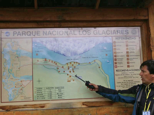 Local guide pointing at a national park map