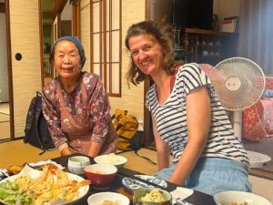 Tourist and local eating dinner together