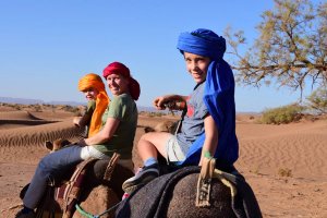 Family riding camels
