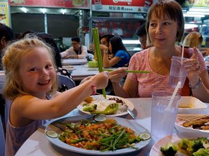 Family eating meal in Malaysia