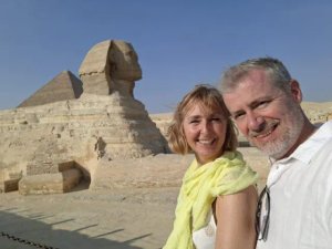 man and woman in front of temple 