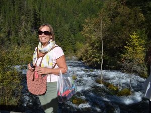 Woman river behind