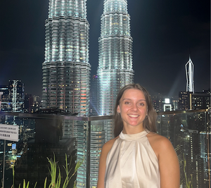 Girl standing infront of towers