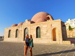 Family outside building Chania