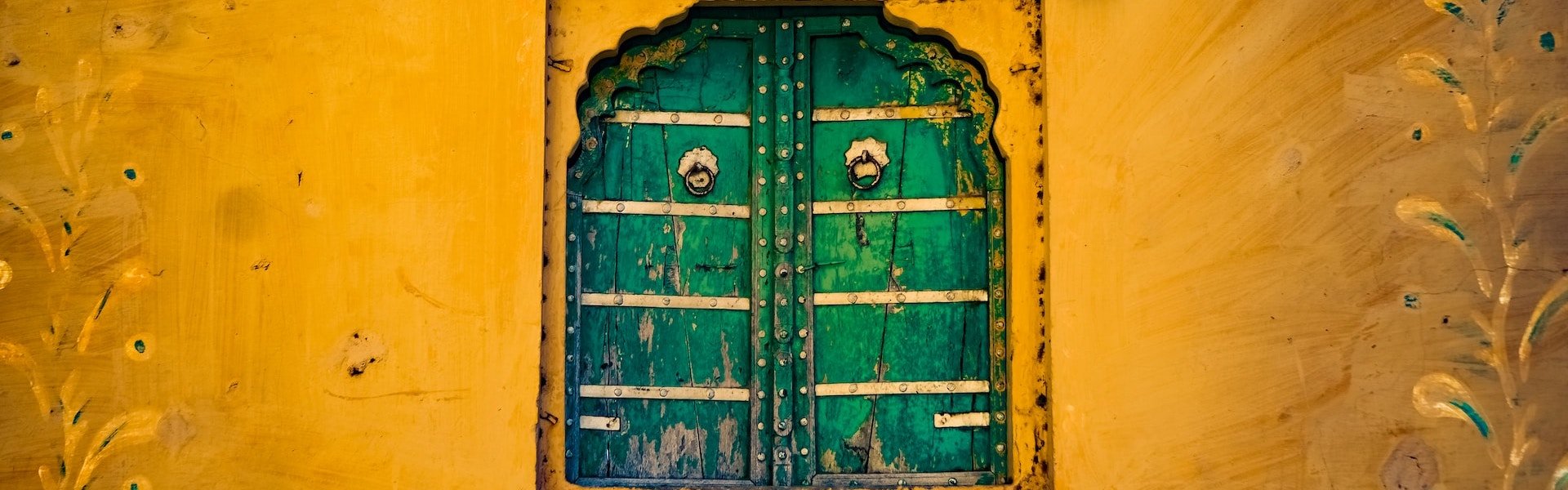 india green wooden window painted wall