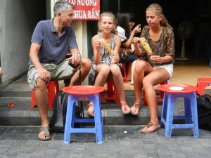Vietnam Hanoi family eating street food
