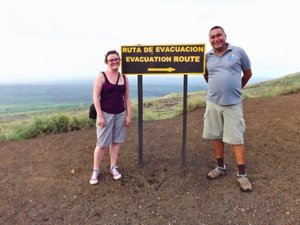 Woman with local partner next to sign