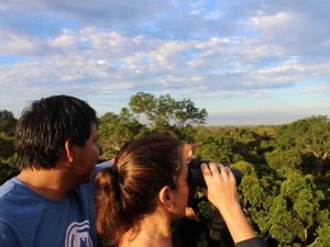 Couple looking through binoculars