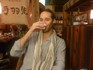 Man drinking tea in restaurant