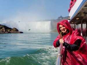 woman on boat at waterfall