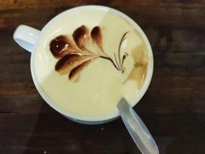 Mug with hot frothy drink
