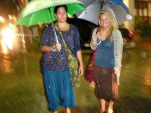 Two women with umbrellas