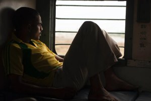 india train man looking out of window