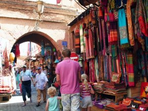 father with children in market