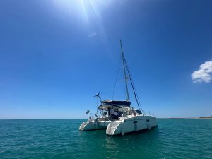 Catamaran floating on blue ocean