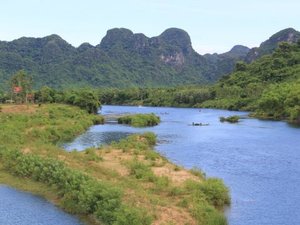 Landscape photo of river and looming cliffs