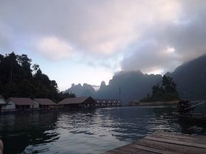 Floating raft huts river view Thailand