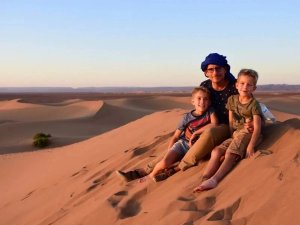 Family sand on sand dunes in Morocco desert
