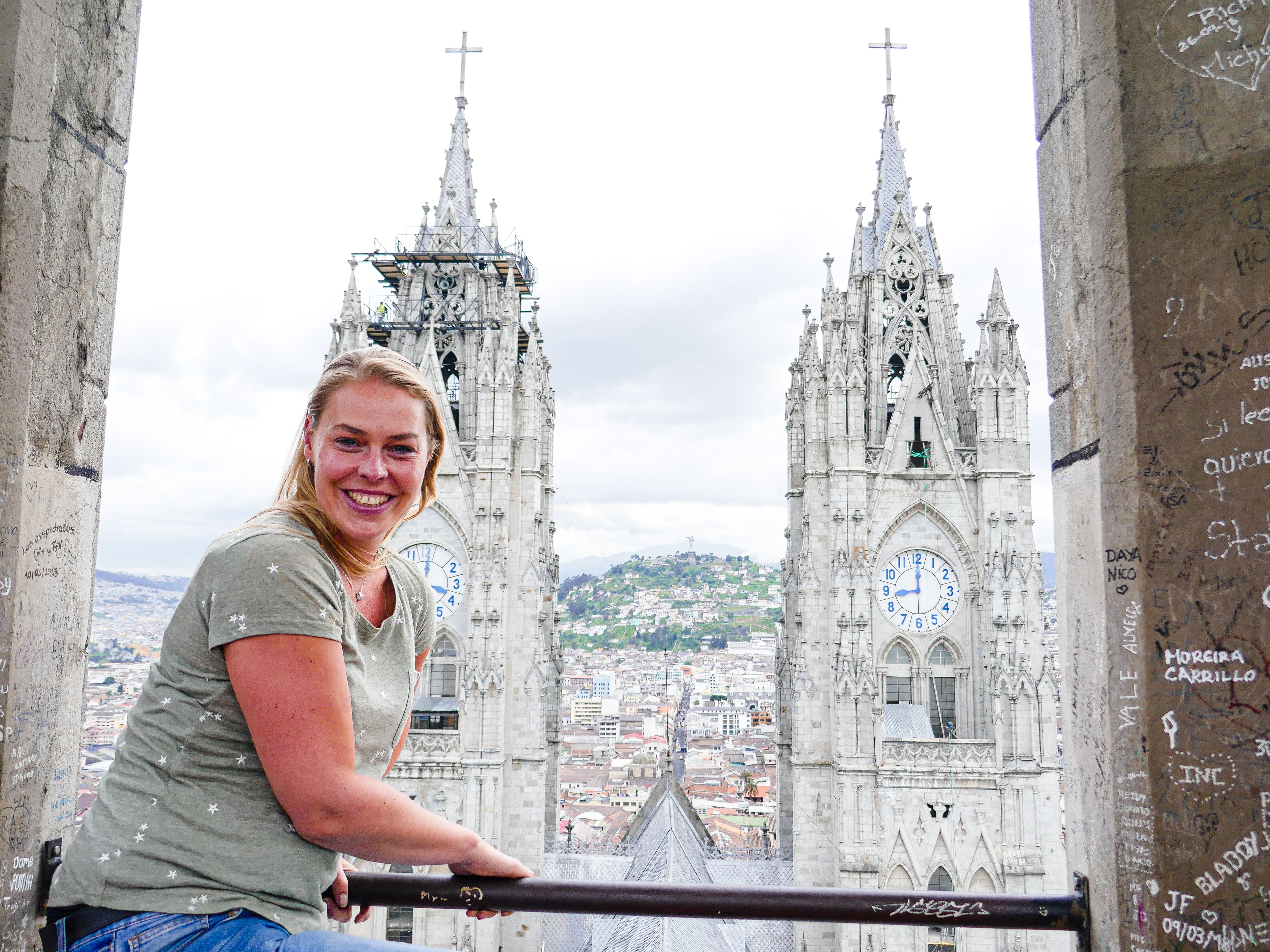 Woman smiling with view of church tower