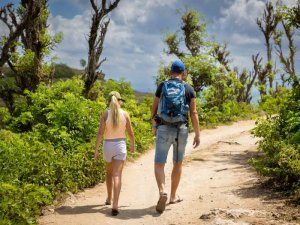 Father and daughter walking on trail Indonesia