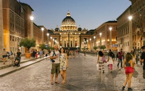 Couple posing on Rome street with magnificent architecture