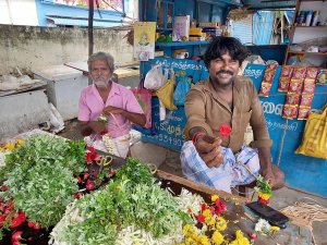 Smiling flower seller in Madurai