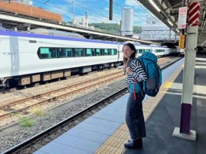 Traveller with backpack at train station