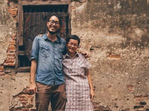 Smiling man and woman with arm around each other