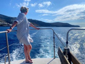 Woman looking at the sea in Greece