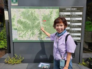 Local guide pointing at map