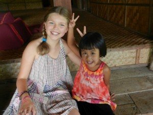 Traveller with local child Thailand