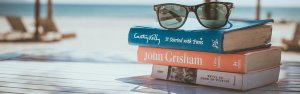 pile of books on beach