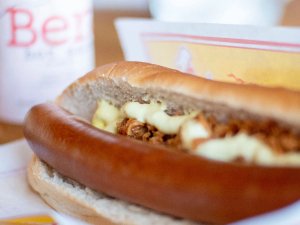 A hot dog in a bun topped with chilli and yellow sauce in Iceland.
