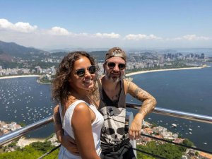 Couple standing at viewpoint over Rio in Brazil